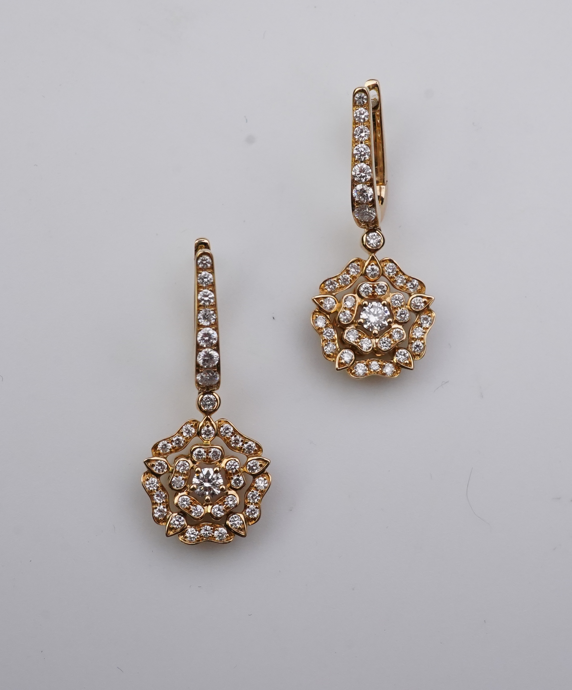 Garrard, a pair of diamond 'Tudor Rose Mini Icon' earrings